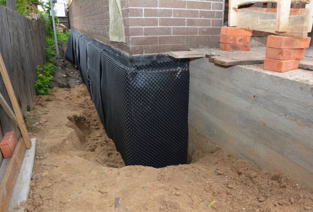 SJ Waterproofing Pros technician performing targeted Vapor Barrier Installation assessment in Swanton, OH